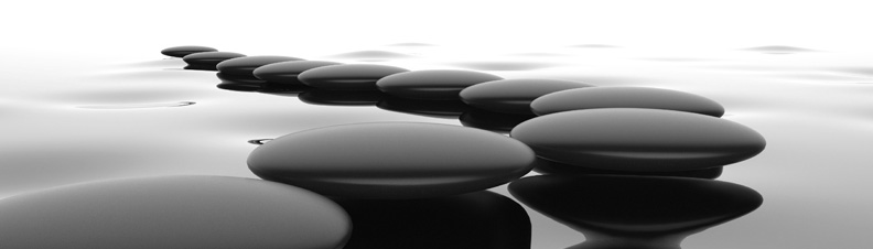 Polished stone path across calm water